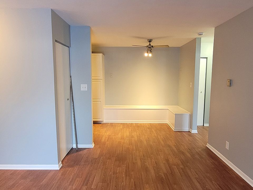 Living room view towards dining area with built in seating arrangement