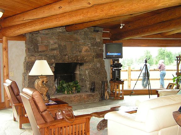 Incredible stone fireplace & walls of windows
