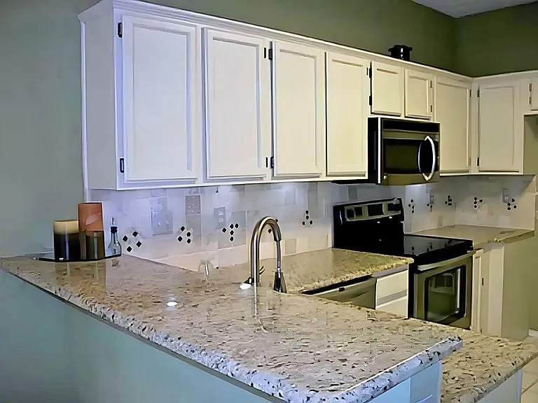 Kitchen with ample cabinets and granite countertop