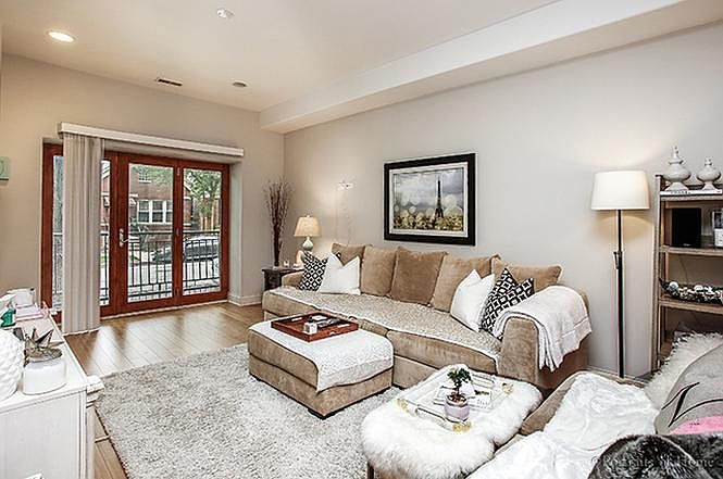 Open-concept living room with Juliet balcony facing Lowe Ave