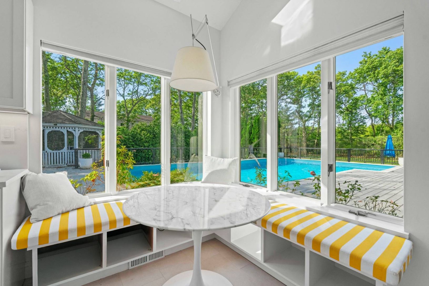 Chefs Kitchen Sunroom dining featuring plenty of natural light and view of Pool Deck & Lounge