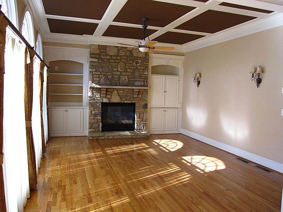 Stacked Stone Fireplace Keeping Room with Coffered Ceilings!