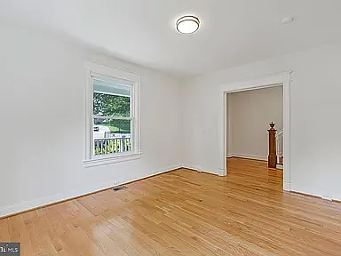 Living room with hardwood floors and lots of natural light