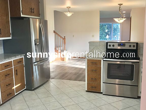 Stainless steel appliances and sink including dishwasher, Refrigerator w/ water and ice dispenser, Bar for eating at kitchen