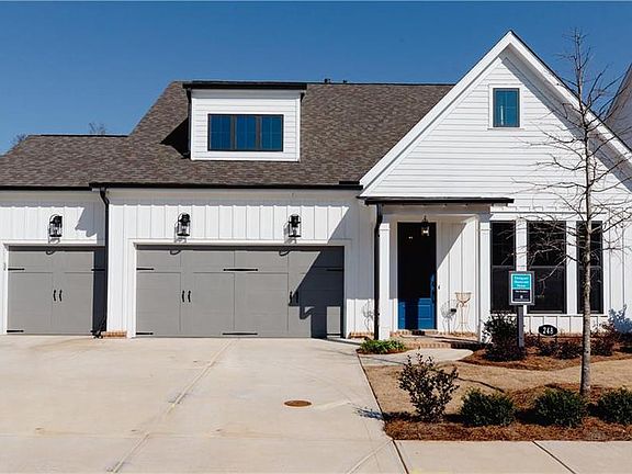 This beautiful Farm house will be painted white and feature a third car garage. This beautiful Farm