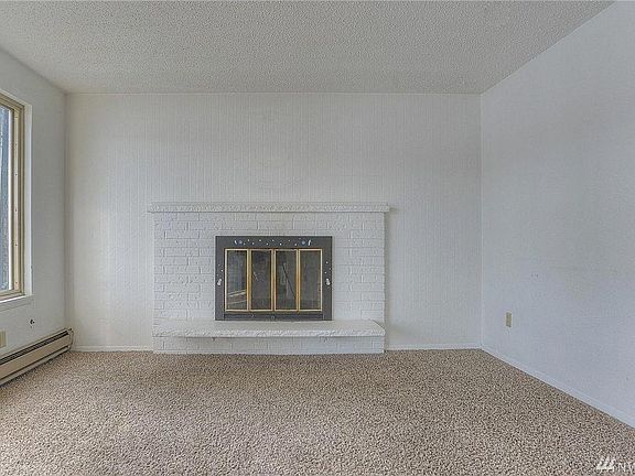 Living Room w/Wood Burning Fireplace