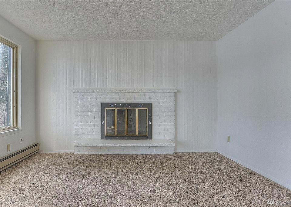 Living Room w/Wood Burning Fireplace