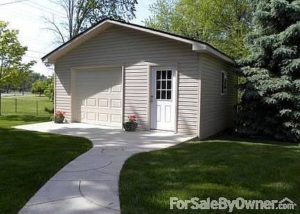Detached Garage/Shed
						:
						This provides great storage for bikes, sports, and garden.
Also 2 car attached.