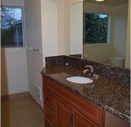 This is a large bathroom with a bathtub / shower.
