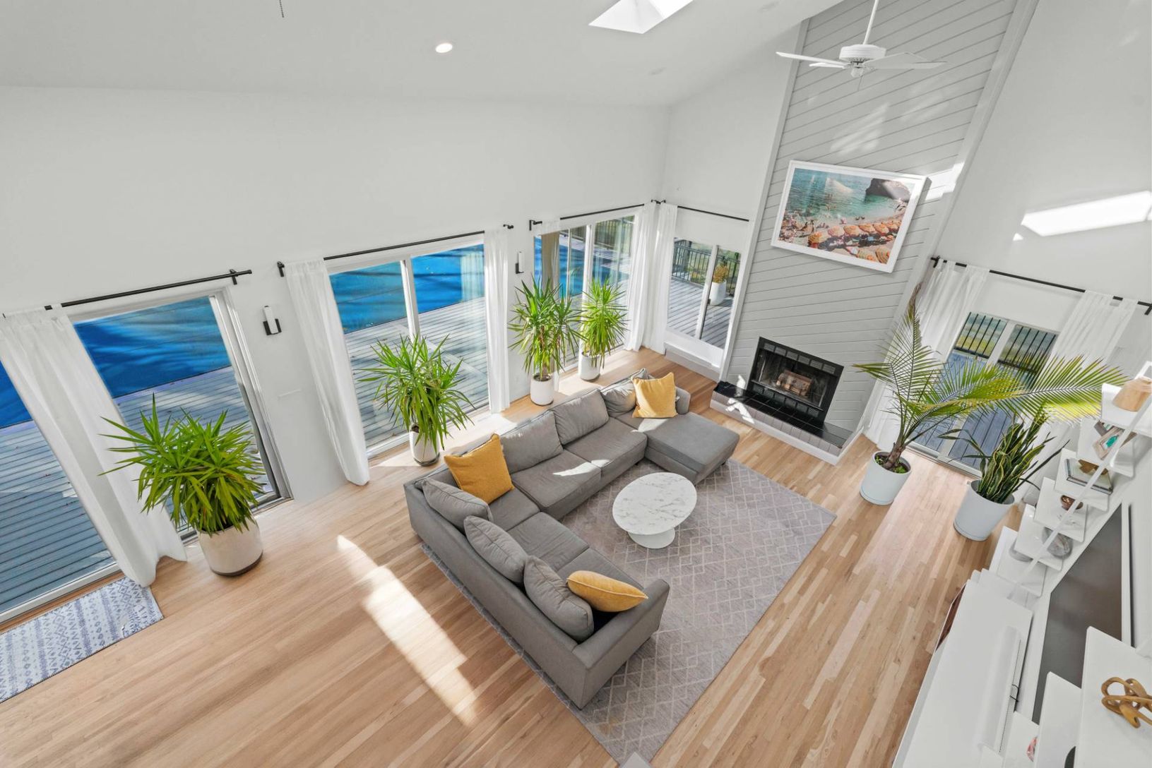 Great Room 2nd Floor balcony View featuring a towering ceiling, oak floors and tons of natural ligh