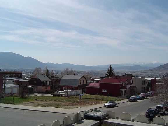 looking at city from 2nd story balcony