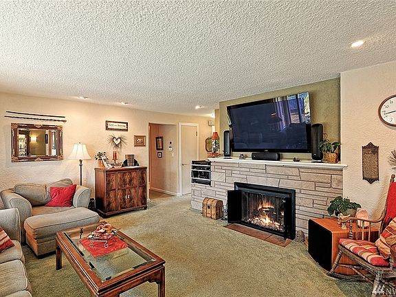 Warm Living Room with picture window to back yard