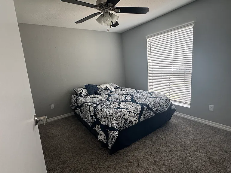 Spacious bedroom fits a full, queen, or king bed and features a large walk-in closet.