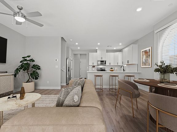 The kitchen seamlessly connects to the spacious living area.