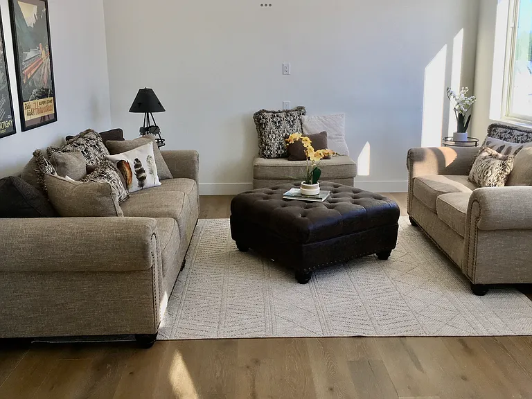 Spacious bonus/media room offering the perfect setting for a TV lounge, cozy gathering space, game room, or additional lifestyle retreat tailored to your needs.
(Photo shown is professionally staged for inspiration; home is offered unfurnished.)