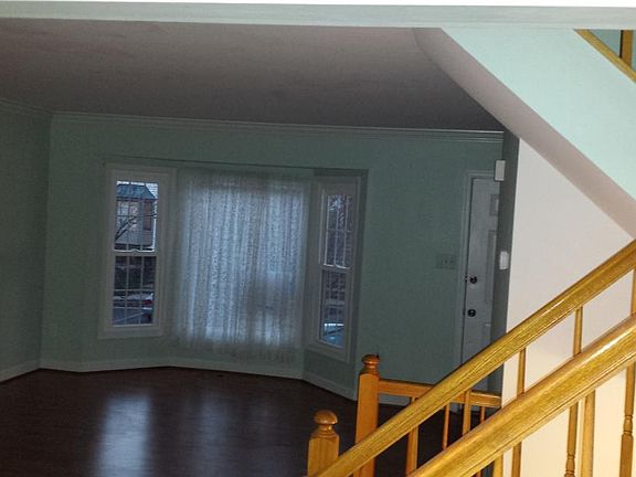 Middle floor: View to the bay window in the living room from the dining room.