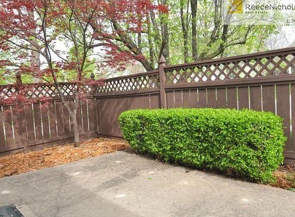 Relax onto your private front patio with pretty Japanese maple