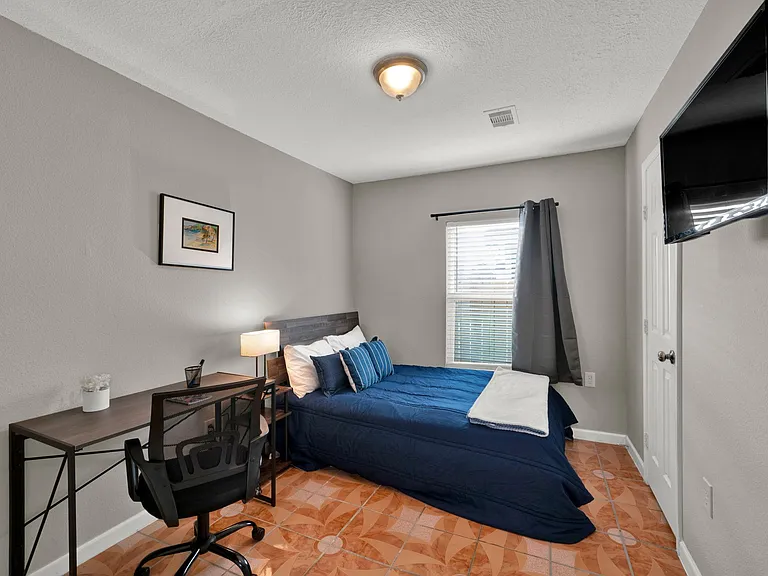 Premium room with workspace, blackout curtains, and TV all included