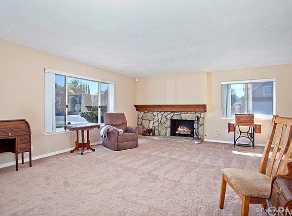 Spacious Living Room with fireplace...new carpet throughout the home.