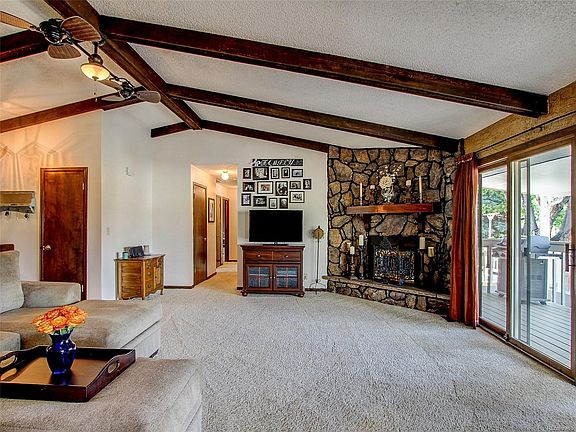 MAIN LEVEL GREAT ROOM. VAULTED CEILINGS. EXPOSED STAINED BEAMS.