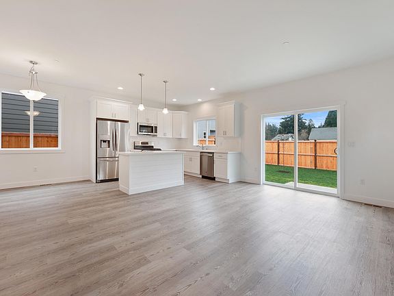 Great room with sliding door access to patio and back yard