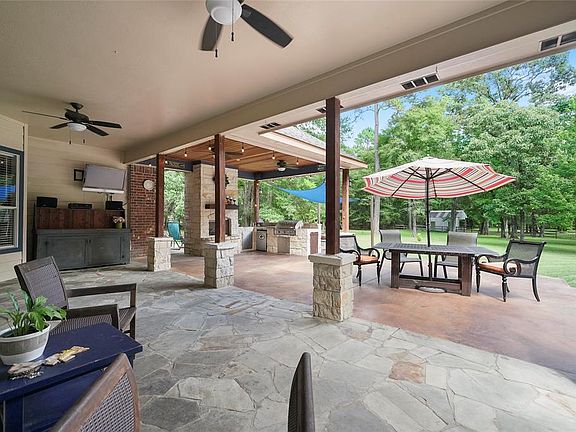 Large entertainment patio with outdoor kitchen and fireplace !