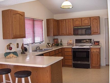 Vaulted kitchen with lots of cabinets