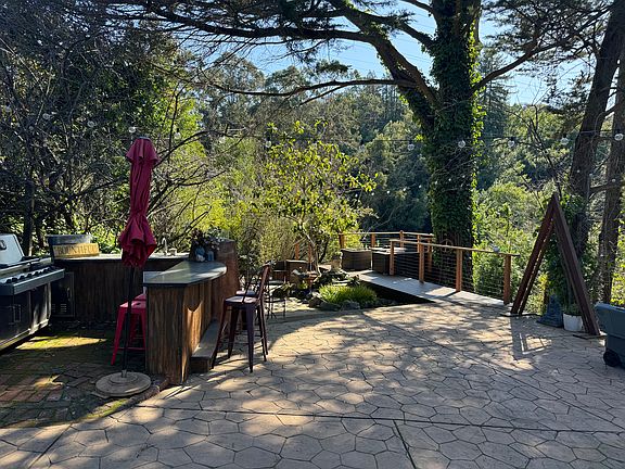 Common space - kitchen, meditation pond, and deck.