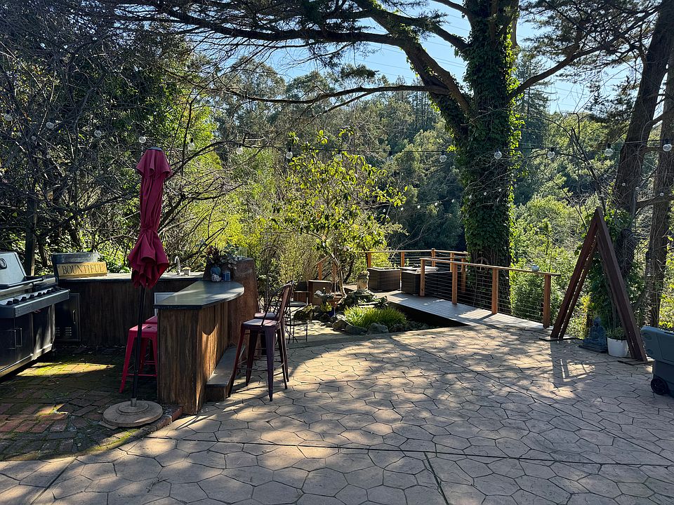 Common space - kitchen, meditation pond, and deck.