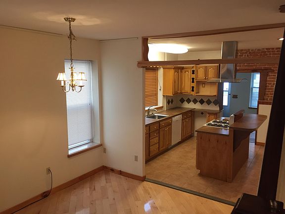 Look __ into kitchen from dining room. Note shelf over kitchen entry for showing off your keepsakes and preserves