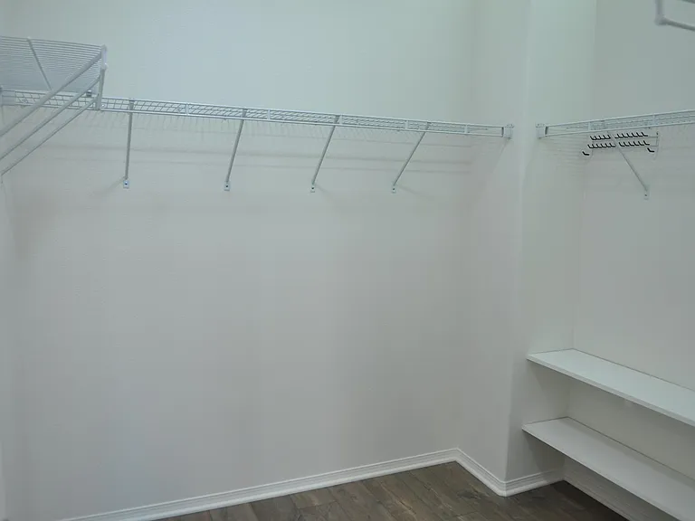 Large Master Walk-In Closet with Custom Lighting