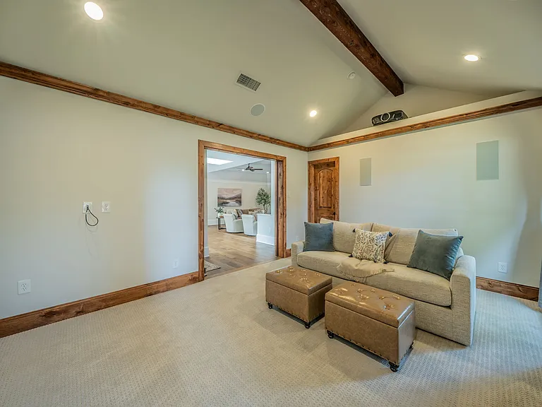 Movie Night Haven: Large Projection Screen, Wood Beams & Cozy Sofa
