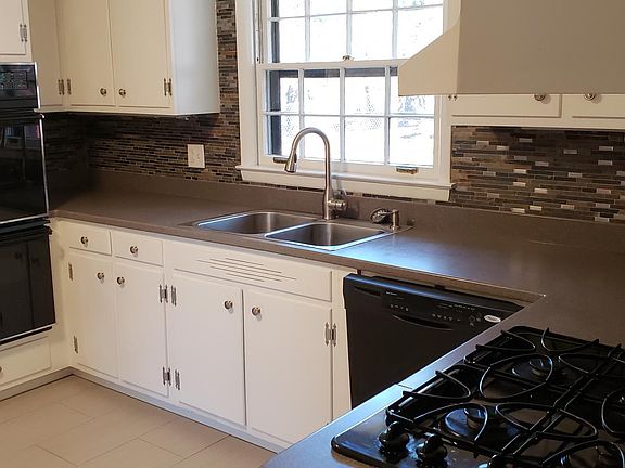 Kitchen overlooking backyard