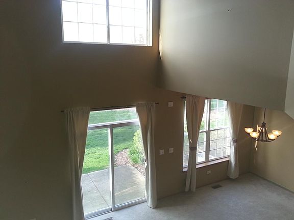 open sunny Bright 2 story living room 