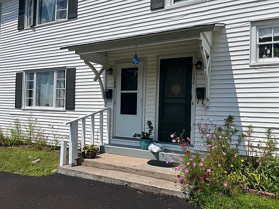 One bedroom, lower level apt's main entrance is one w railing on left.