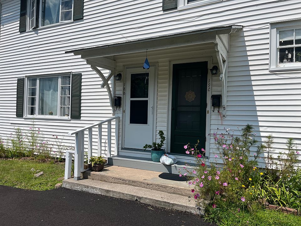 One bedroom, lower level apt's main entrance is one w railing on left.