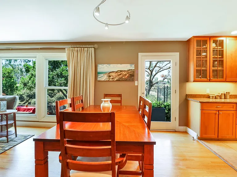 Dining Area with all glass garden door to access backyard.