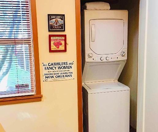Laundry closet (supply shelves left wall of closet)