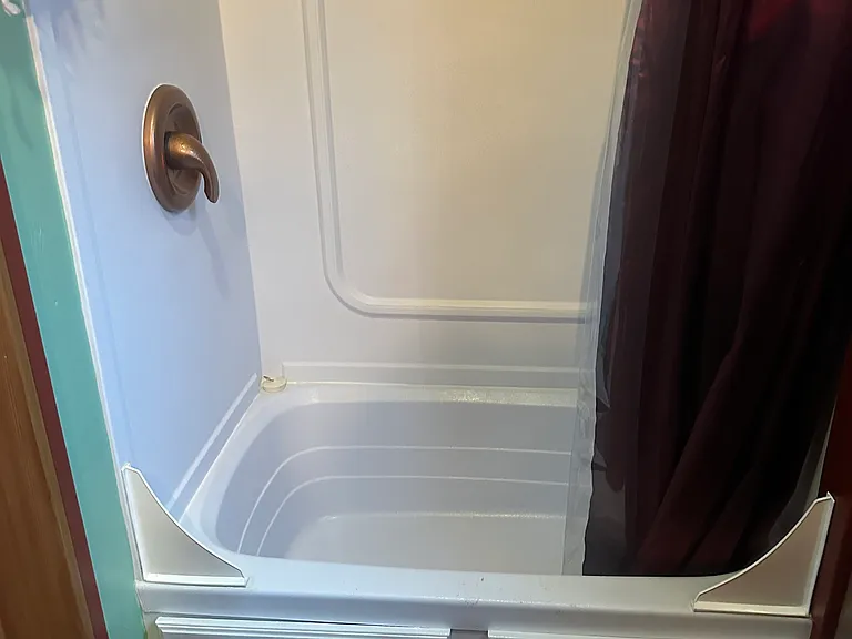 There's a tiny tub, but, since the water heater is also tiny, think of it as a really deep shower pan!