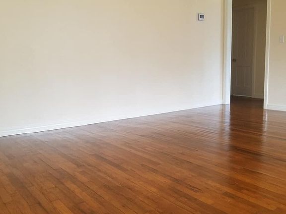 Living room. Looking from front door towards hallway.