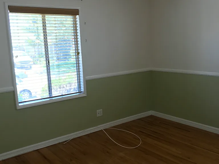 Second bedroom at front of house has original oak flooring.