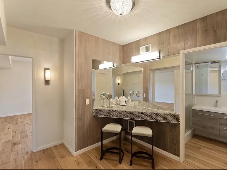 Lower-level bathroom with spacious vanity.
