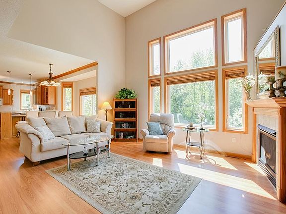 The main level living room is spacious, open and very warm with brand new wood floors.