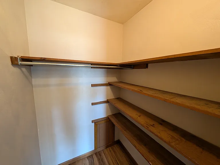 Convenient closet between the bedroom and bathroom.