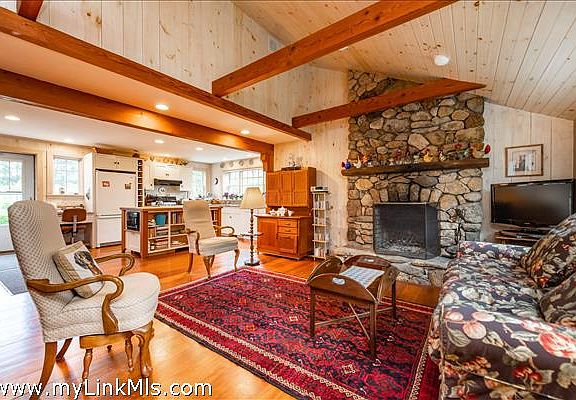 Living Room with Fireplace into Kitchen