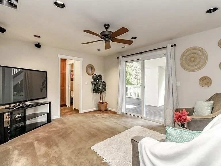 door leads to large laundry area and bathroom