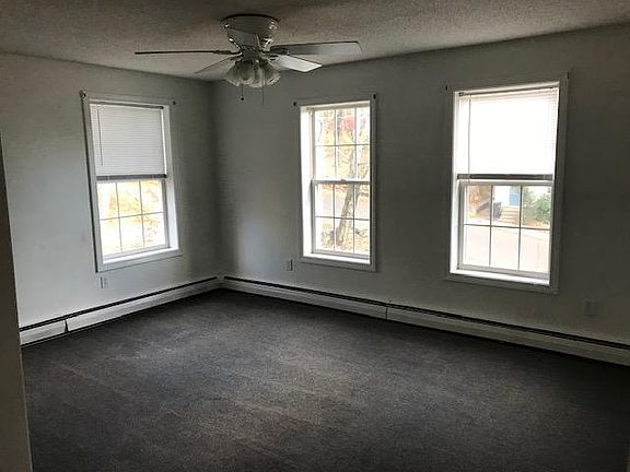Livingroom with w/w carpeting and coat closet.