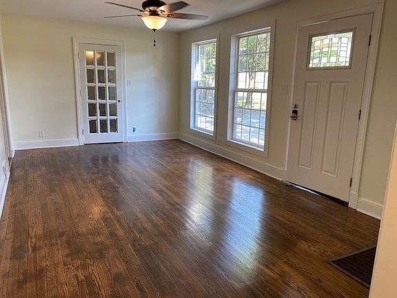 Living room with door to den in front