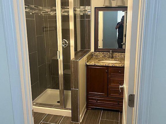 Master Bathroom with beautiful Tiles and Standing Shower