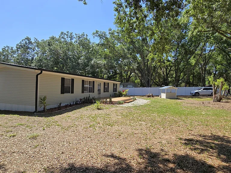 Front of Home
"Charming renovated manufactured home on a gated half-acre lot."